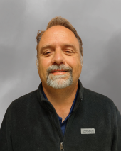 Man in black shirt with beard